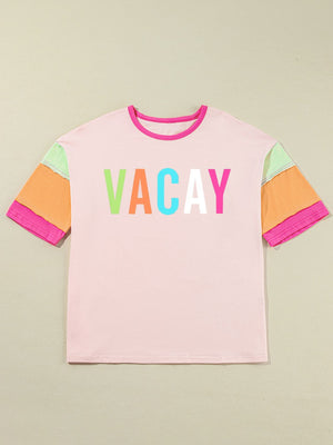 Colorblock graphic tee in pink with "VACAY" text and multi-colored sleeves.