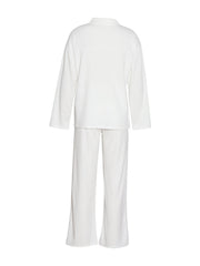 White ribbed knit lounge set with relaxed fit top and wide leg pants