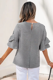 Black and white gingham shirt with ruffled sleeves and a keyhole back closure.