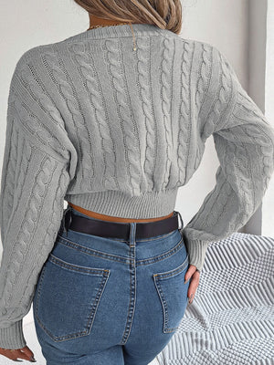 Dark gray acrylic cable knit cropped sweater with twist front detail