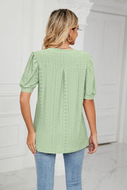 Sage perforated puff sleeve blouse with eyelet detail and keyhole back.