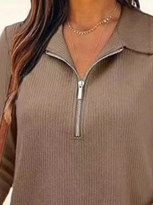 Ribbed knit half-zip top in Khaki with a silver zipper detail.
