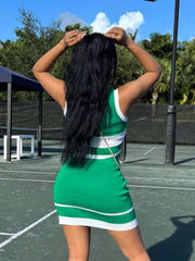 Green knit activewear set with white contrast trim and horizontal stripes.