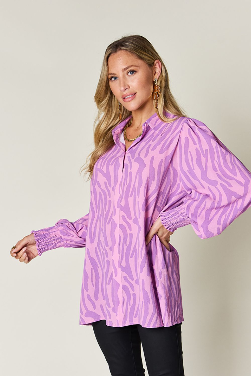 Lavender zebra print blouse with shirred cuffs and puff sleeves.