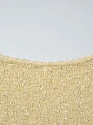 Yellow sheer one-shoulder cropped cardigan with intricate knit pattern