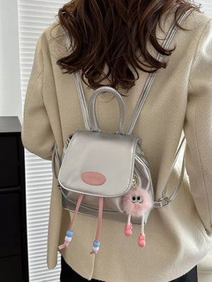 Silver leather mini drawstring backpack with pink beaded tassels and fluffy charm.