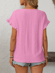 Watermelon pink eyelet knit blouse with ruffled short sleeves and a textured pattern.
