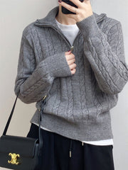 Dark Gray cable knit quarter-zip pullover sweater with a white t-shirt underneath.