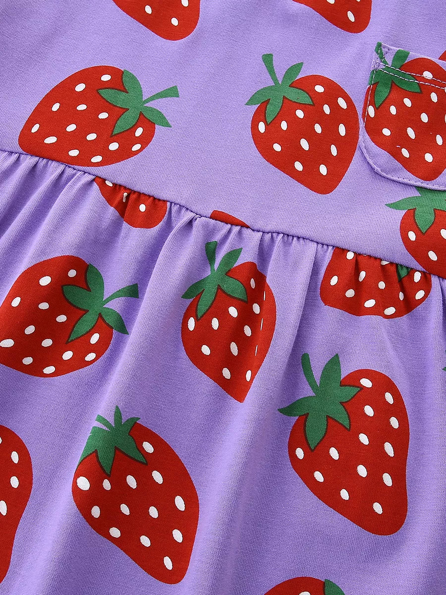 Lavender cotton blend toddler dress with allover red strawberry print and a chest pocket.
