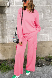 Pink cargo pocket lounge set with crewneck sweatshirt and drawstring pants.