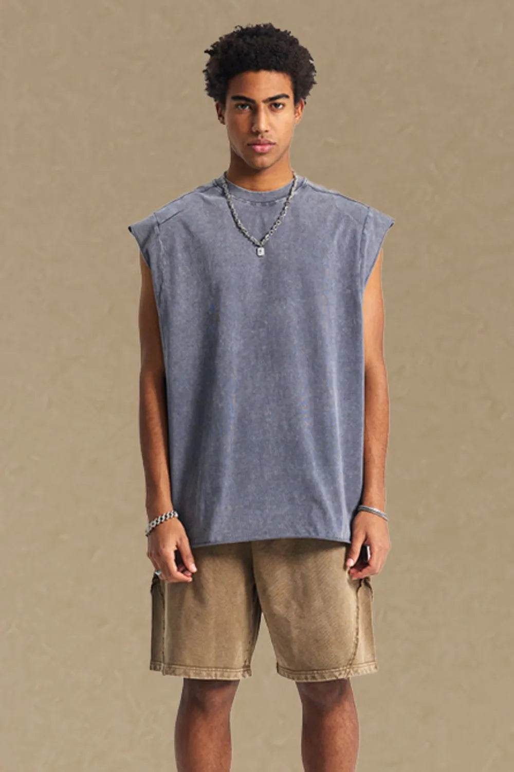Raw edge muscle tank top in gray with a relaxed fit and crew neck.