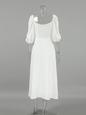 White midi dress with puff sleeves and square neckline, textured fabric, a-line cut