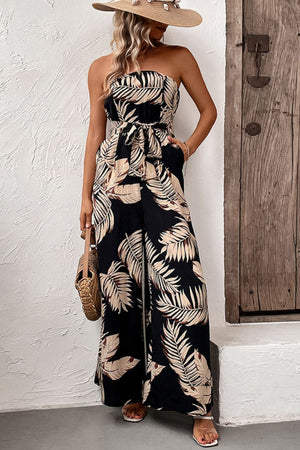 Black tropical leaf print bandeau jumpsuit with tie waist and wide legs