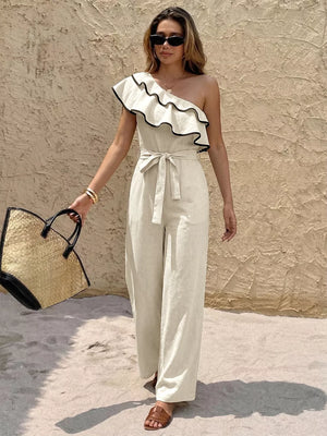 Elegant one-shoulder romper with ruffle trim and belted waist, wide leg pants