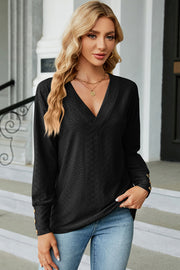 Black diamond-textured v-neck blouse with button cuff detail