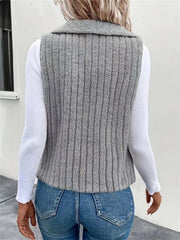 Textured teddy collarless vest in gray with vertical ribbing detail.