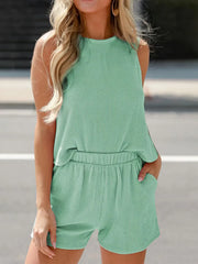 Sleeveless striped coord set in Gum Leaf green with elastic waist shorts and crew neck top.
