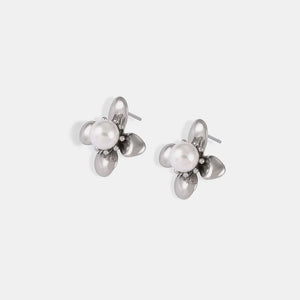Silver petal pearl stud earrings with a floral design.