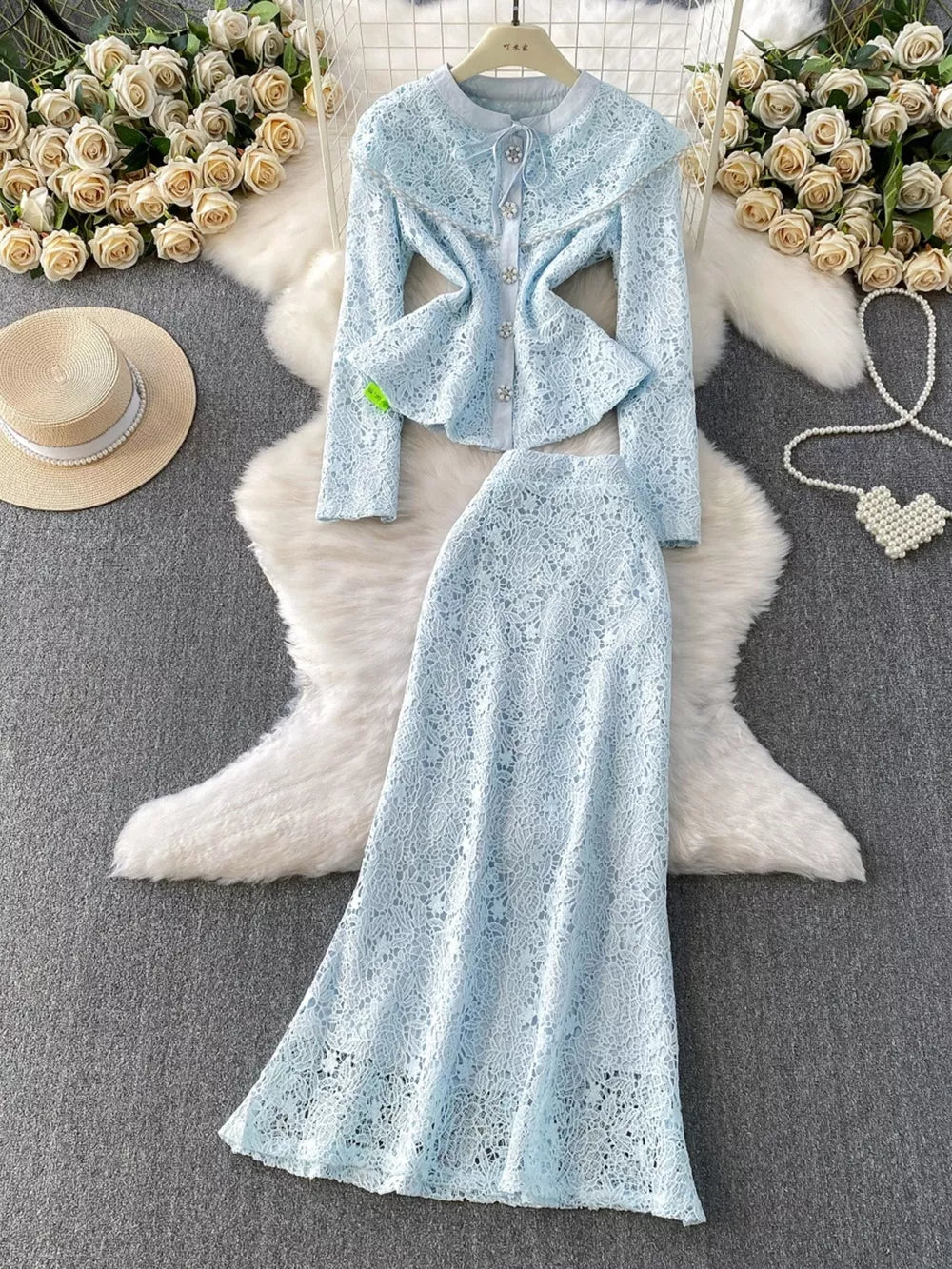 Light blue lace peplum top and maxi skirt set with pearl button details.