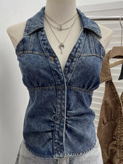 Blue denim halter top with collar, button front, and gathered waist detail.