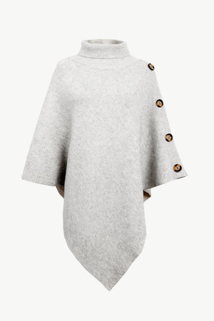 Light gray knit poncho with turtleneck and button detail on shoulder.