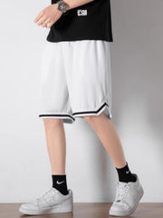 Men's white athletic shorts with black trim detail and drawstring waist.