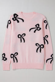 Pink knit crewneck sweater with allover black bow motifs and ribbed cuffs and hem.