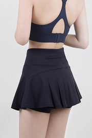 Dark blue sculpted flared active skort with built-in shorts and pleated skirt detail
