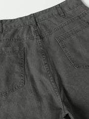 Grey cargo pants with buckle detail and pockets, showing back view and stitching.