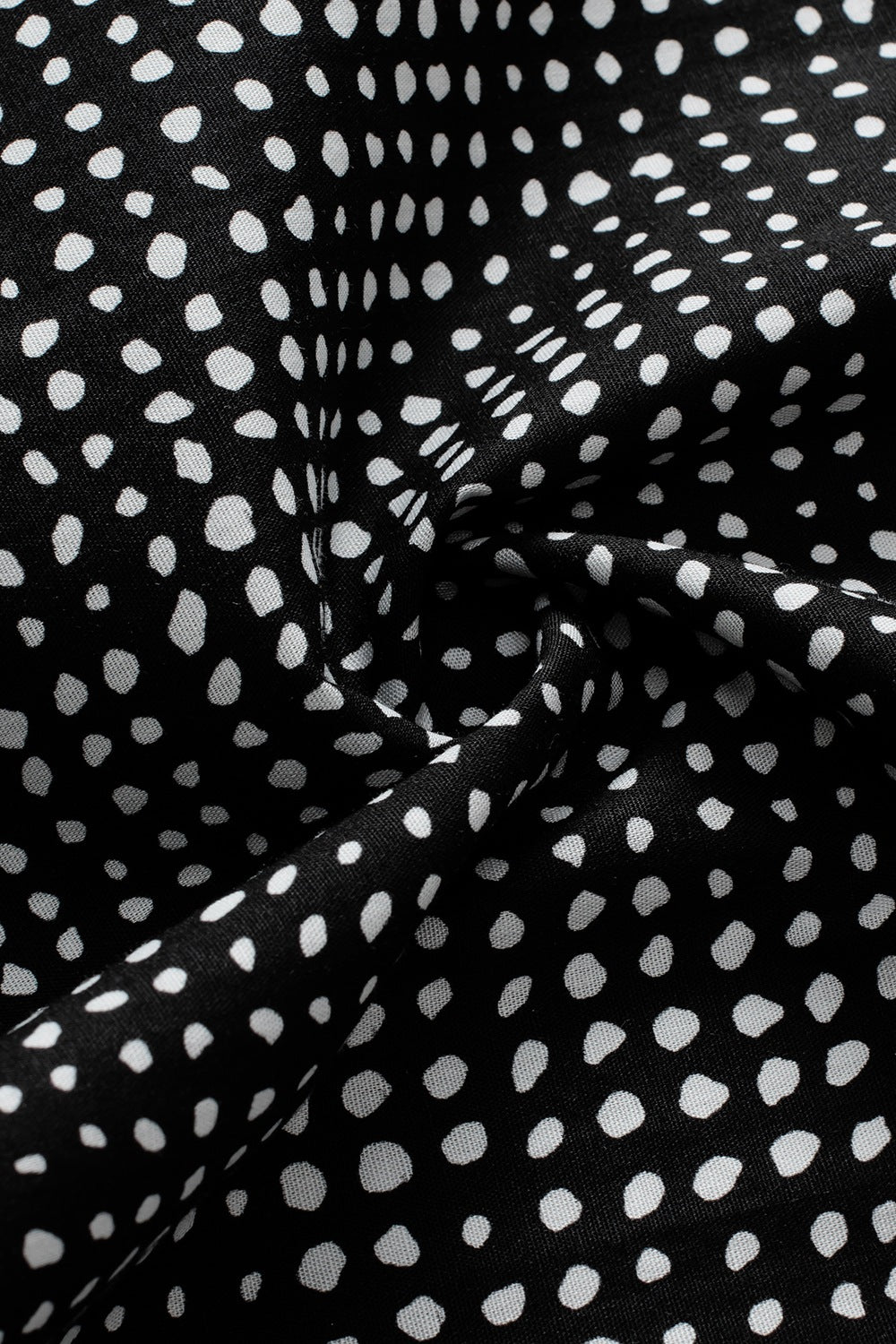 Black dotted puff sleeve blouse fabric detail