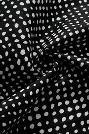 Black dotted puff sleeve blouse fabric detail