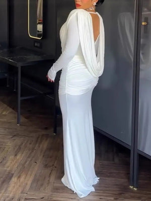 White ruched long-sleeve maxi dress with cowl neck and draped back detail.