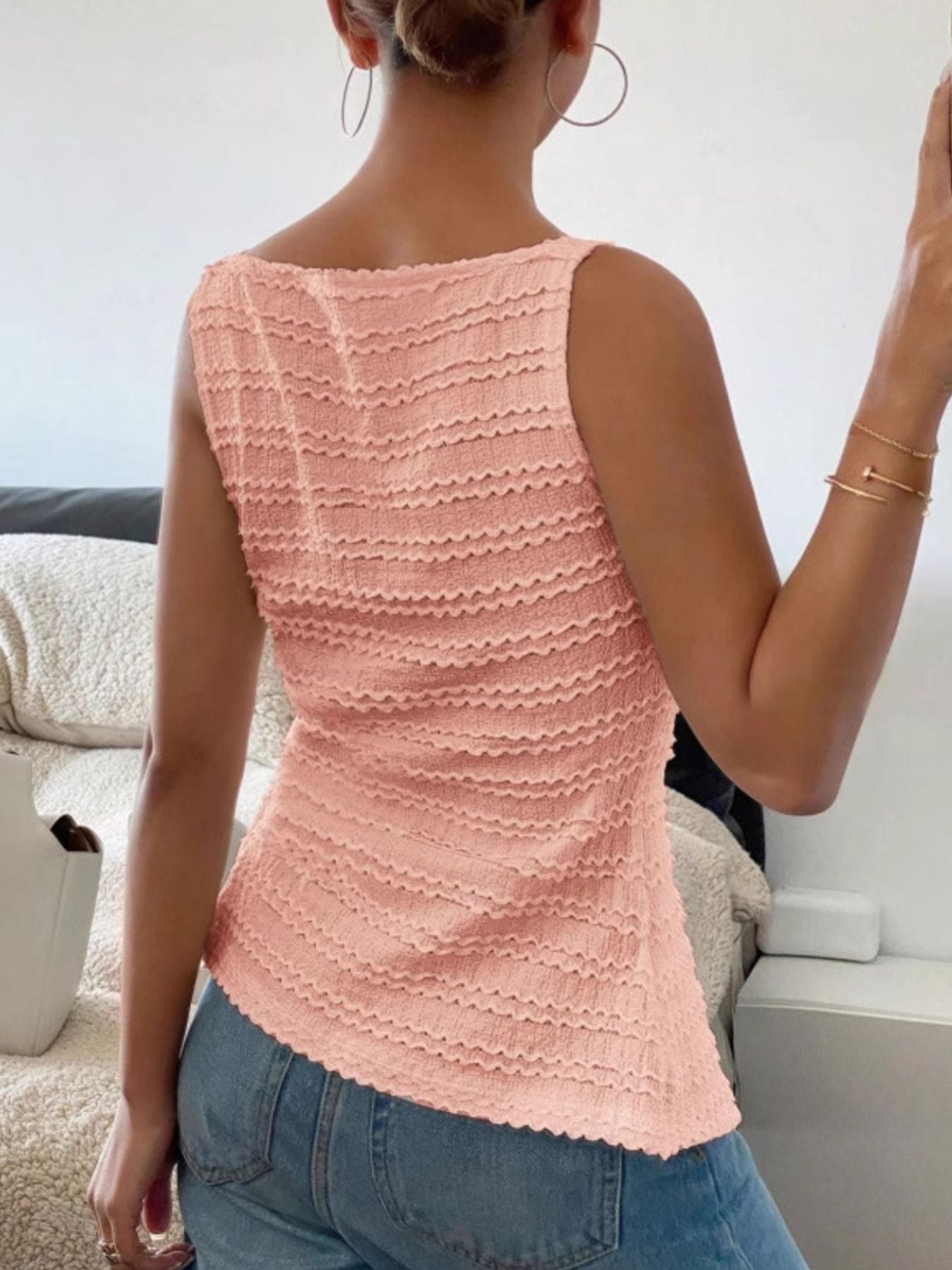 Peach wavy textured button-front tank top with a square neckline.