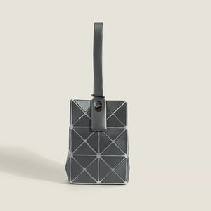 Sleek mini tote bag in black with geometric panel design and single strap.
