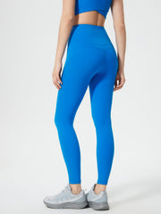 Blue high-waisted sculpted contour leggings with V-seam detail and pocket.