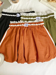 Lace-trimmed gathered waist mini skirt in orange, black, and army green with white stripe details.
