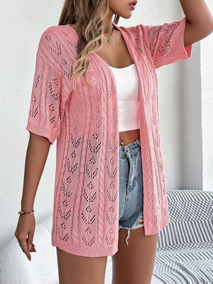 Pink open-knit pointelle cardigan with short sleeves and a V-neck.