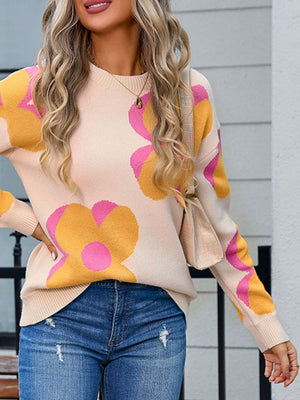 Oversized knit sweater in ivory with large floral print in apricot and fuchsia pink.
