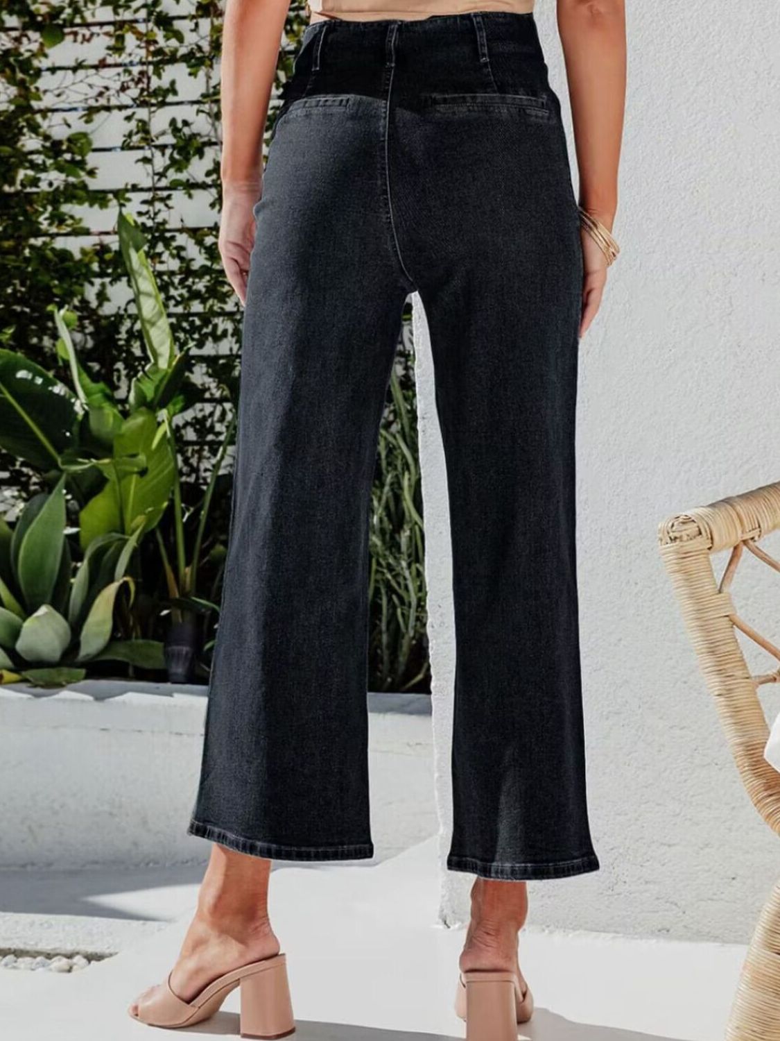 Black button-front wide-leg cropped jeans with a high waist.