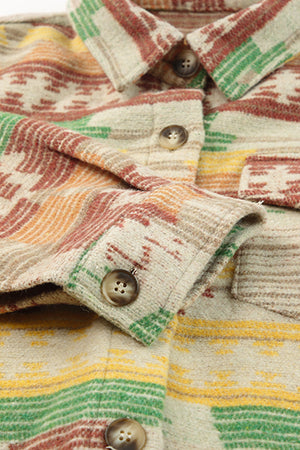 Shacket with Aztec print, button front, and patch pockets in tan with red, green, and yellow stripes.