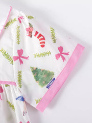 Toddler dress with Christmas print, Peter Pan collar detail, and pink trim.