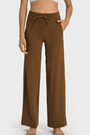 Brown wide-leg lounge joggers with utility pockets and drawstring waist