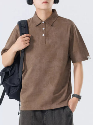 Brown cotton polo shirt with subtle texture and buttoned placket.