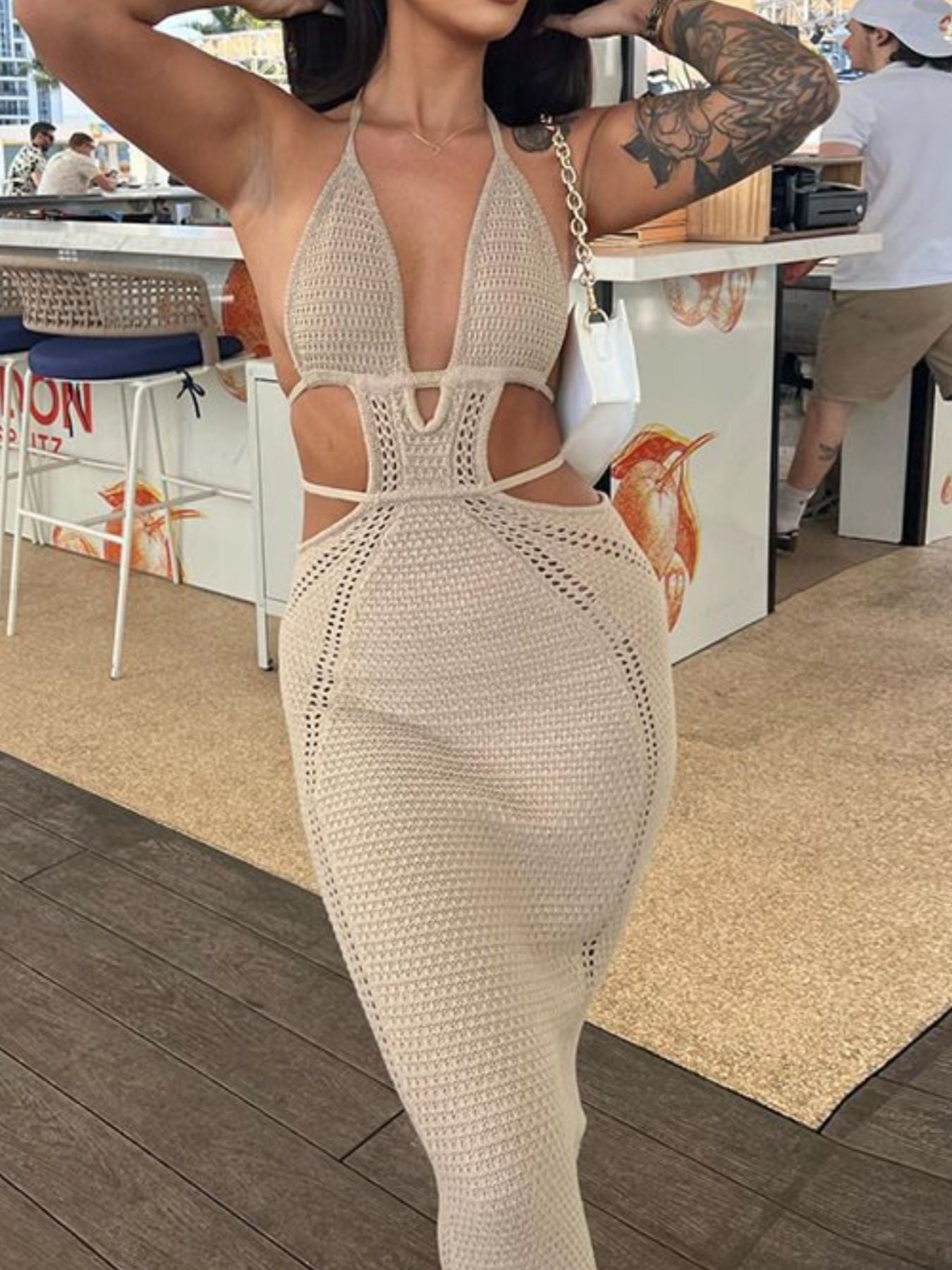 Khaki knitted maxi dress with deep v-neck, cutouts and backless detail
