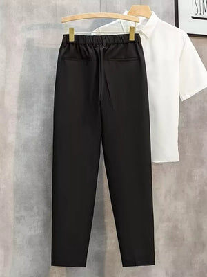 Black straight-leg cargo pants with elastic waistband and back pockets.