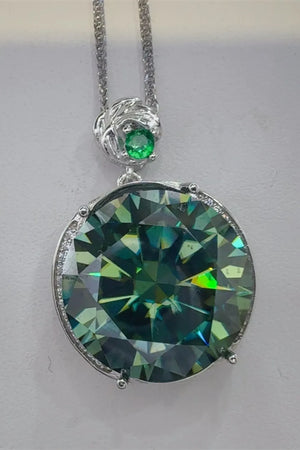Dark green moissanite and sterling silver necklace with a small emerald accent.