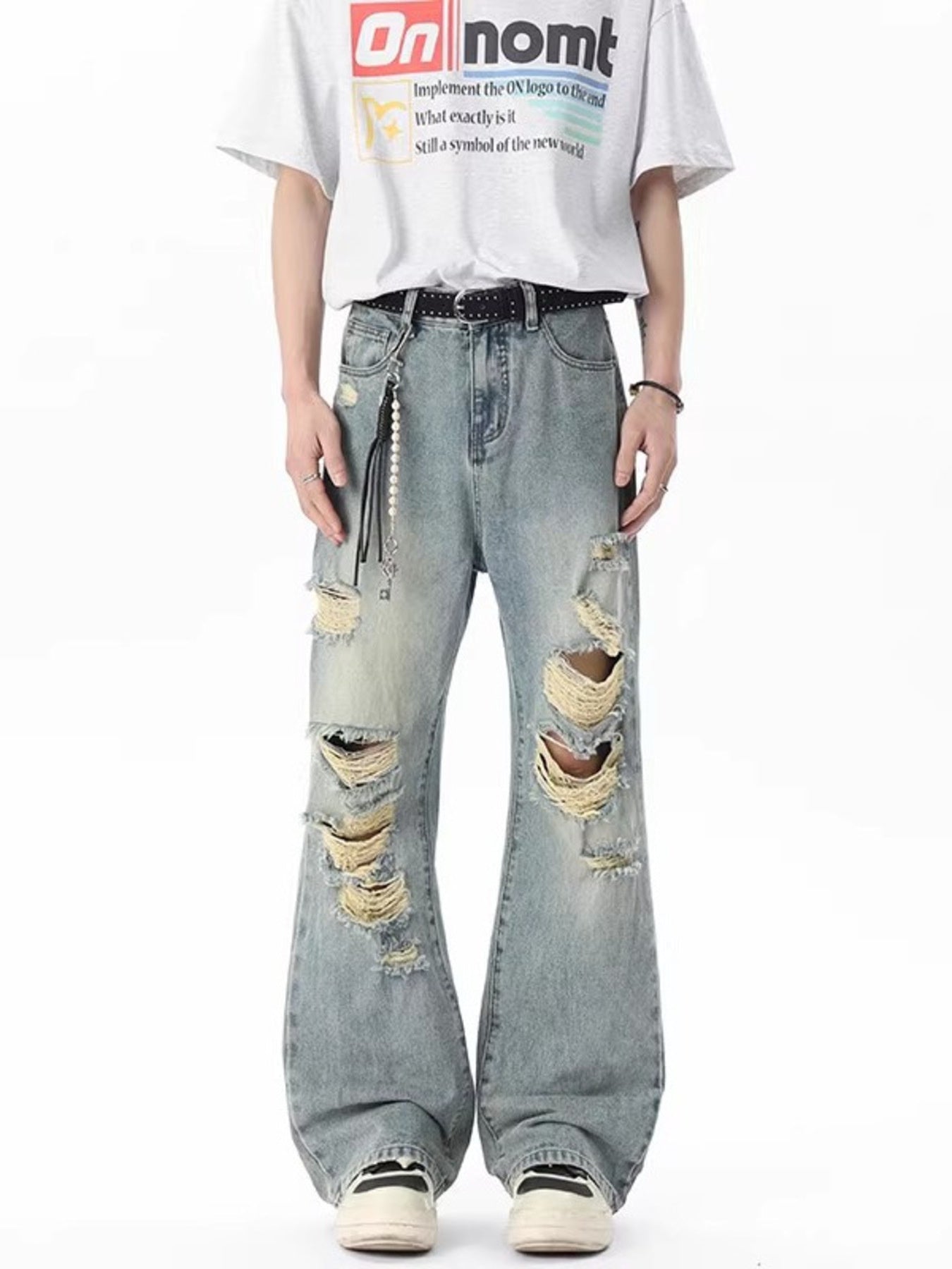 Men's light gray distressed wide-leg jeans with frayed details and ripped accents.