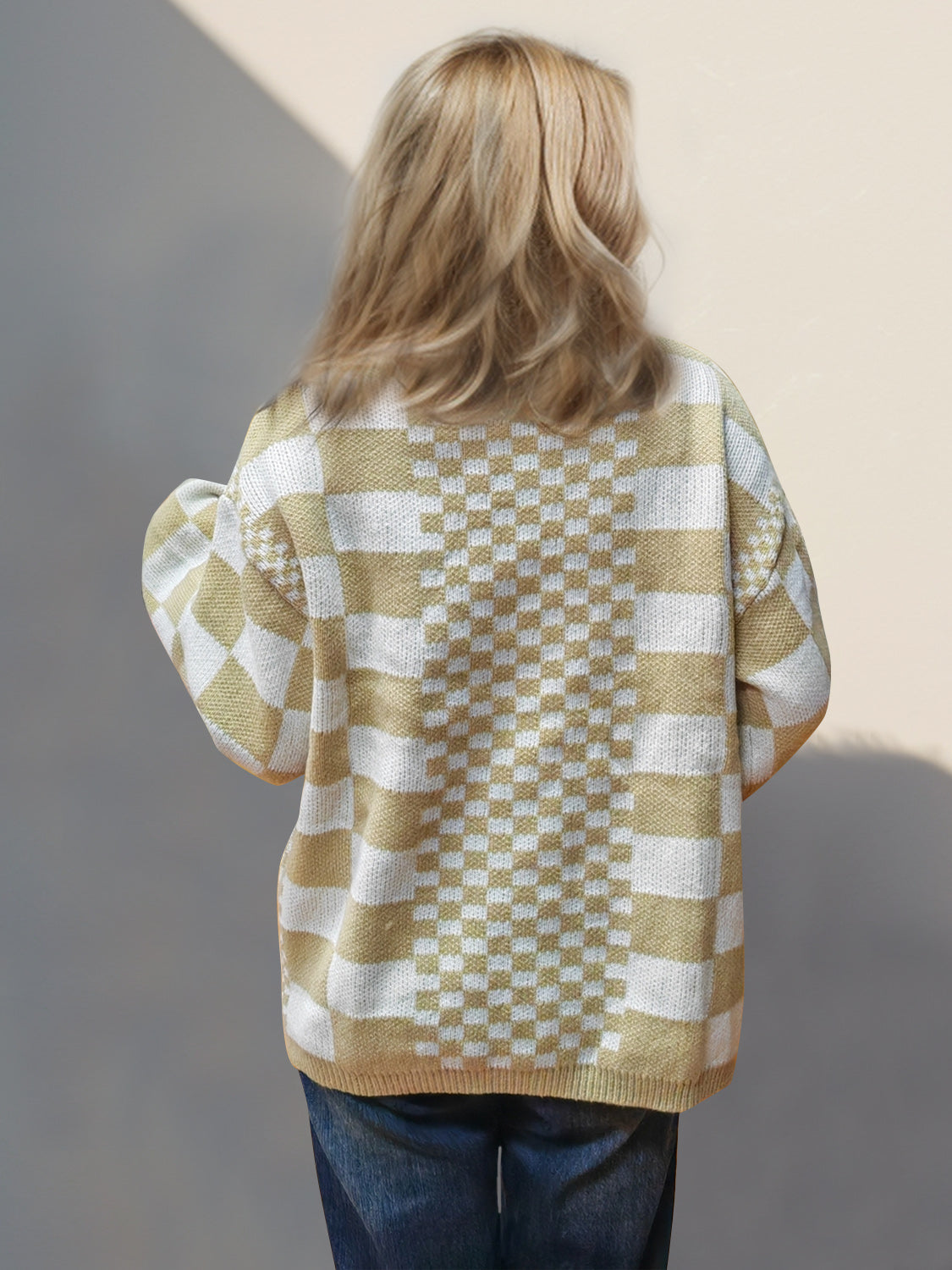 Checkerboard knit open-front cardigan in tan with a crew neck and long sleeves.