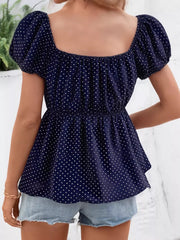 Navy polka dot peplum shirt with puff sleeves and square neckline