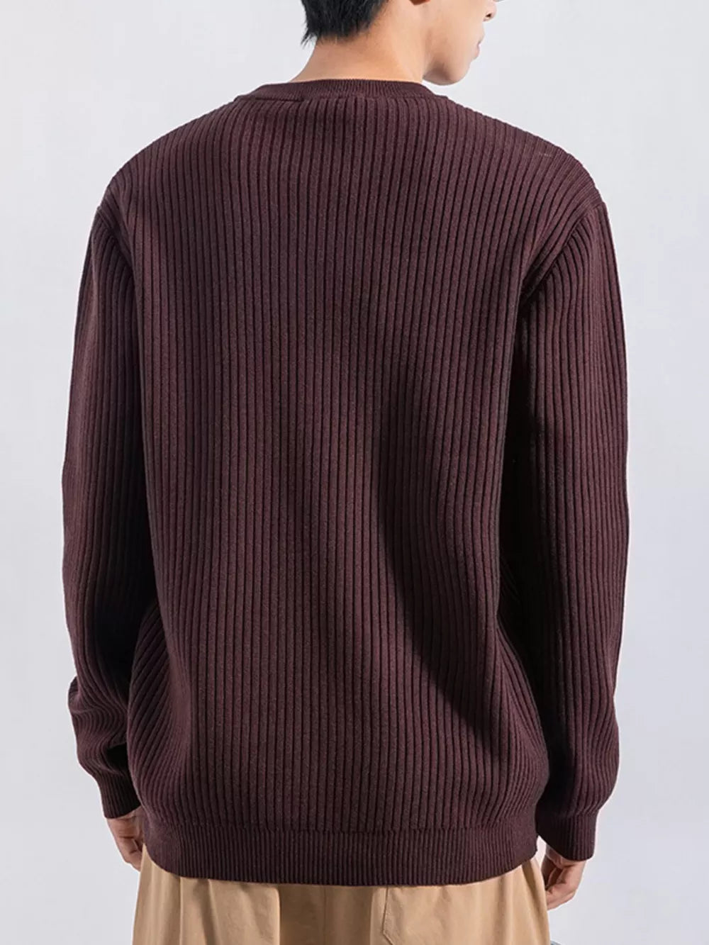 Men's ribbed knit top in dark curry with button details, crew neck, long sleeves.